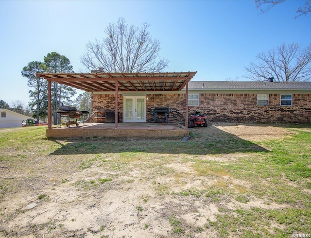 111 Westgate Ter, Hot Springs, AR 71913 - rear view of house with a patio, brick siding, a lawn, and french doors