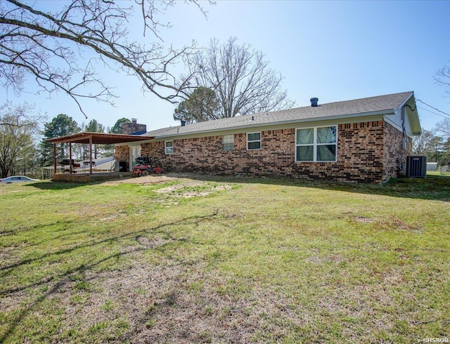 111 Westgate Ter, Hot Springs, AR 71913 - view of front of house with central air condition unit, a front lawn, brick siding, a carport, and a chimney