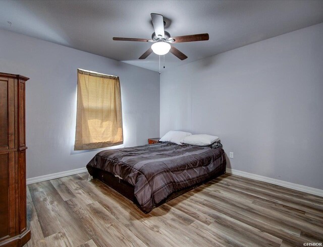 111 Westgate Ter, Hot Springs, AR 71913 - bedroom featuring baseboards, a ceiling fan, and light wood-type flooring