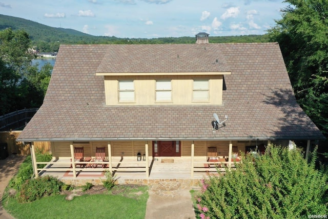 280 Overview Cir, Hot Springs, AR 71913 - view of front of house with a chimney, covered porch, and a mountain view