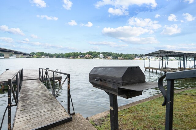 view of dock with a water view and boat lift