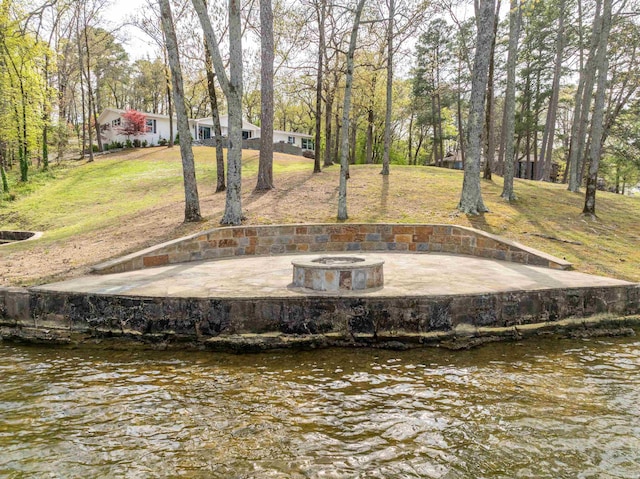 201 Summertime Bay, Hot Springs, AR 71913 - view of green lawn with an outdoor fire pit and a water view