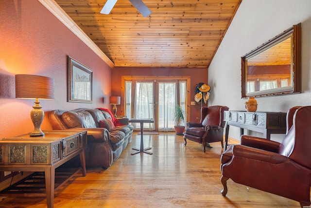 living area featuring wooden ceiling, light wood-style flooring, vaulted ceiling, french doors, and crown molding