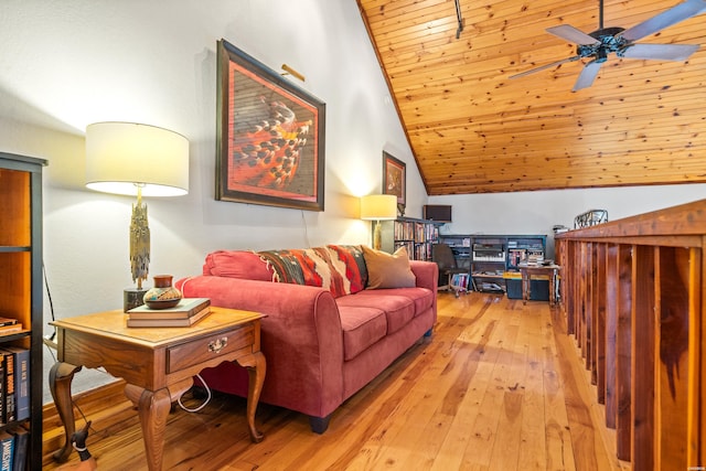 living room with vaulted ceiling, ceiling fan, and light wood finished floors