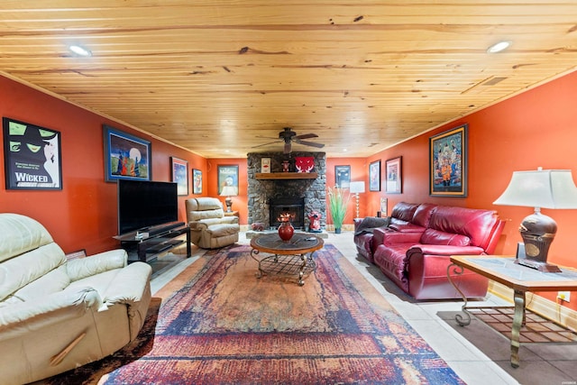 living room with a stone fireplace, wooden ceiling, tile patterned flooring, and a ceiling fan