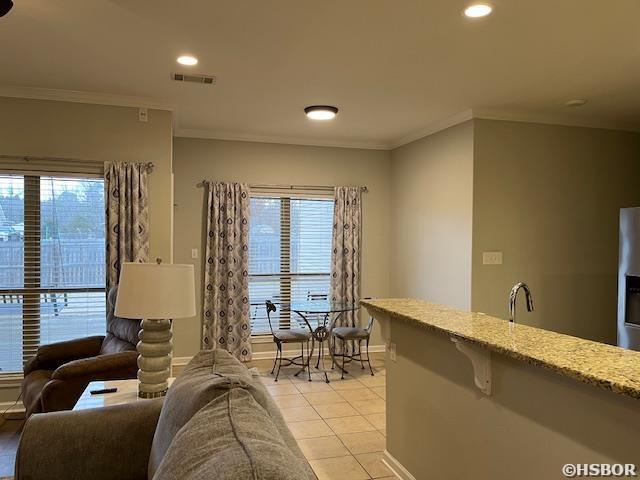107 Legacy Ln, Hot Springs, AR 71901 - living room with plenty of natural light, visible vents, crown molding, and light tile patterned floors