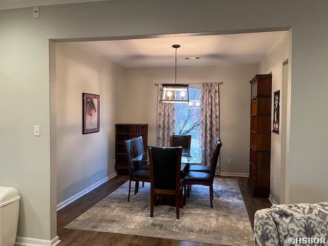 107 Legacy Ln, Hot Springs, AR 71901 - dining area featuring dark wood-style flooring and baseboards