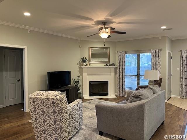 107 Legacy Ln, Hot Springs, AR 71901 - living room featuring a fireplace, wood finished floors, a ceiling fan, baseboards, and crown molding