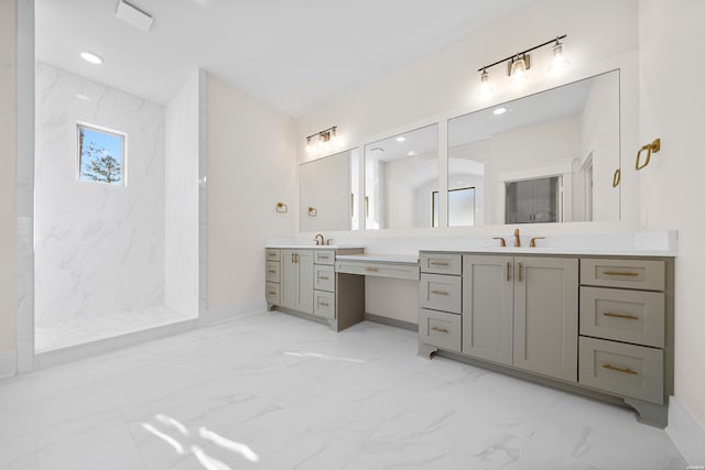 bathroom with recessed lighting, vanity, baseboards, marble finish floor, and walk in shower