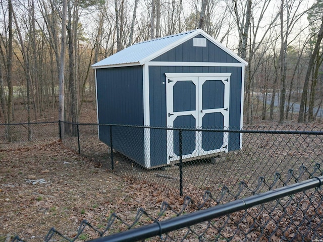 view of shed with fence