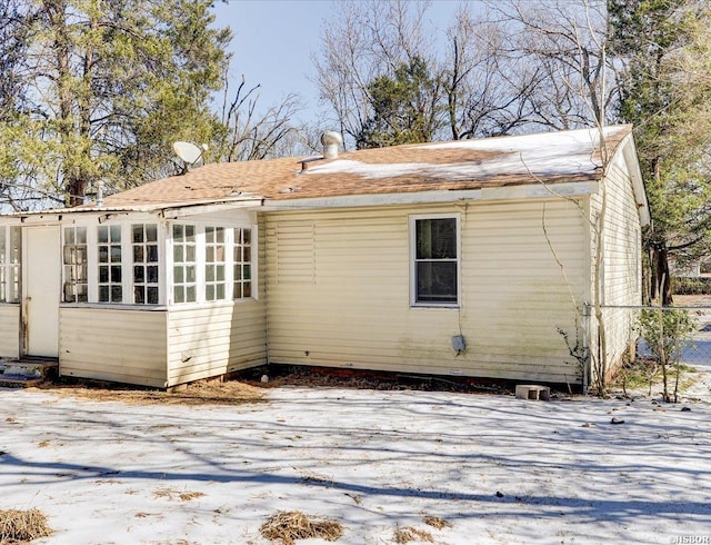 view of snow covered house