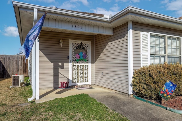 property entrance with central AC and fence