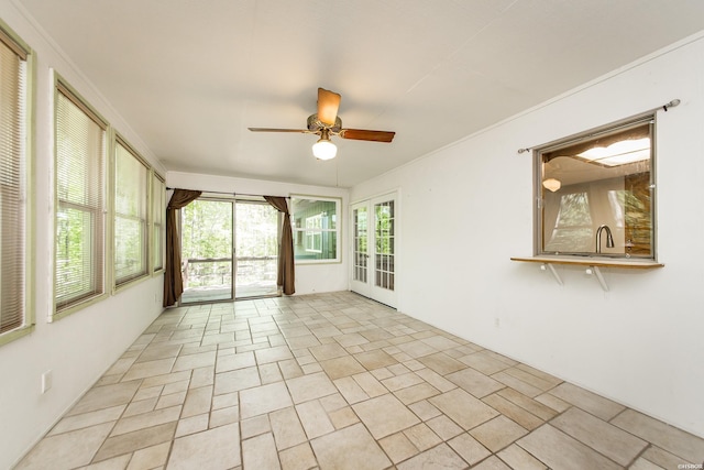 unfurnished sunroom featuring french doors