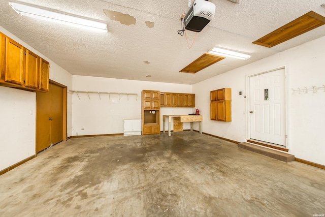 garage featuring baseboards and a garage door opener