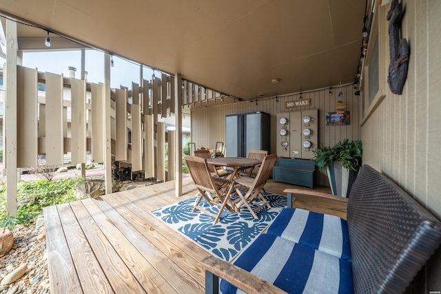 wooden deck featuring outdoor dining space