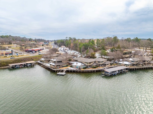 drone / aerial view with a water view and a residential view