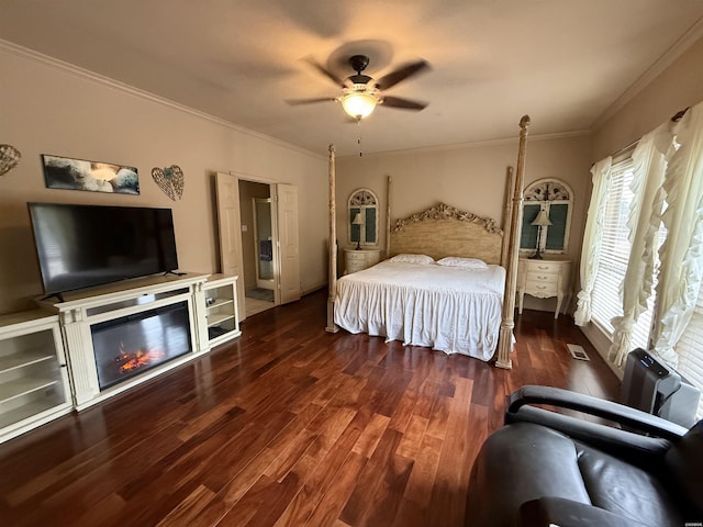 bedroom featuring dark wood-style floors, crown molding, radiator heating unit, and a ceiling fan