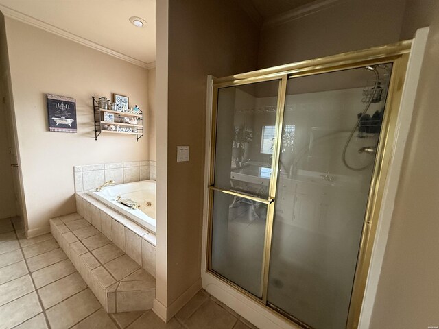 bathroom with a bath, tile patterned flooring, crown molding, and a shower stall