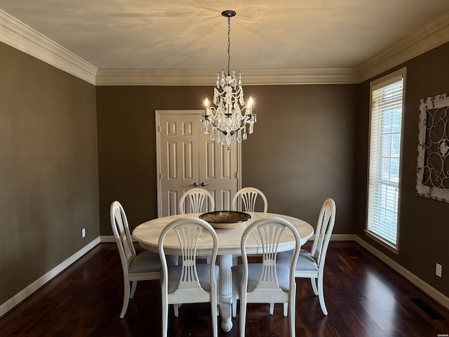 dining room featuring a chandelier, dark wood-type flooring, and baseboards