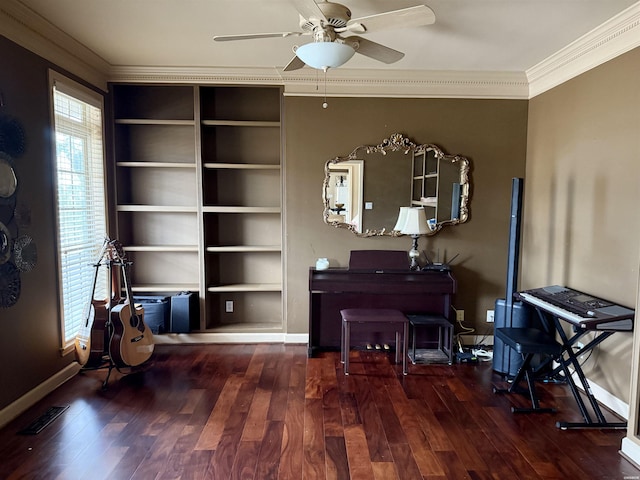 living area with dark wood finished floors, visible vents, crown molding, and baseboards