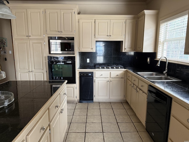 kitchen featuring decorative backsplash, dark countertops, black appliances, a sink, and light tile patterned flooring