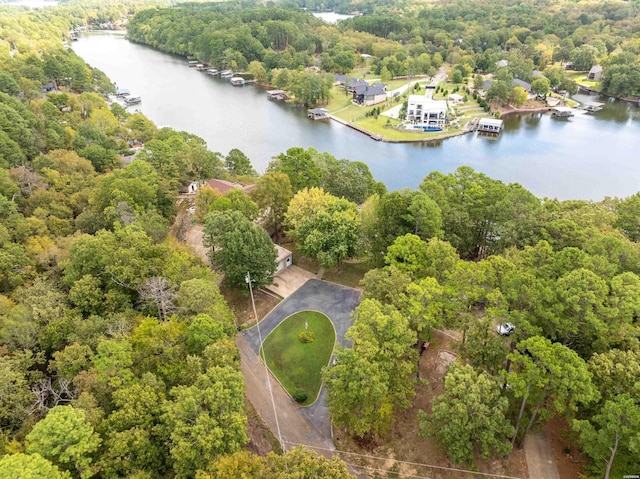 drone / aerial view featuring a water view and a wooded view