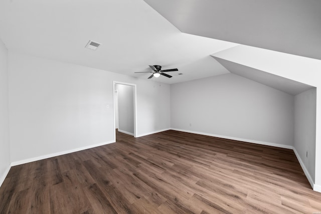 bonus room featuring visible vents, ceiling fan, vaulted ceiling, wood finished floors, and baseboards