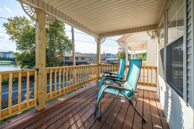 wooden deck with a water view