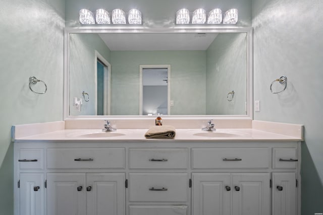 bathroom with double vanity and a sink