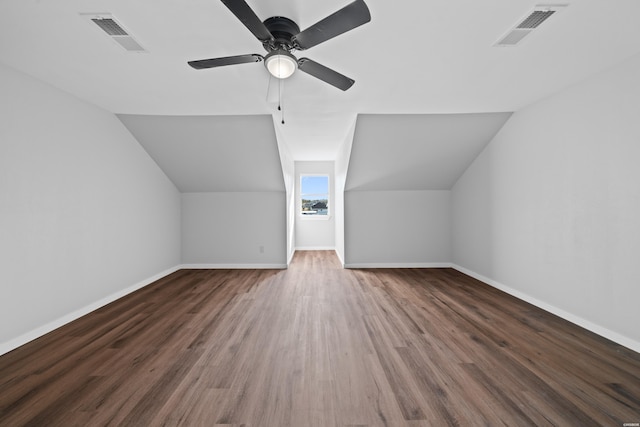 additional living space with visible vents, baseboards, and wood finished floors