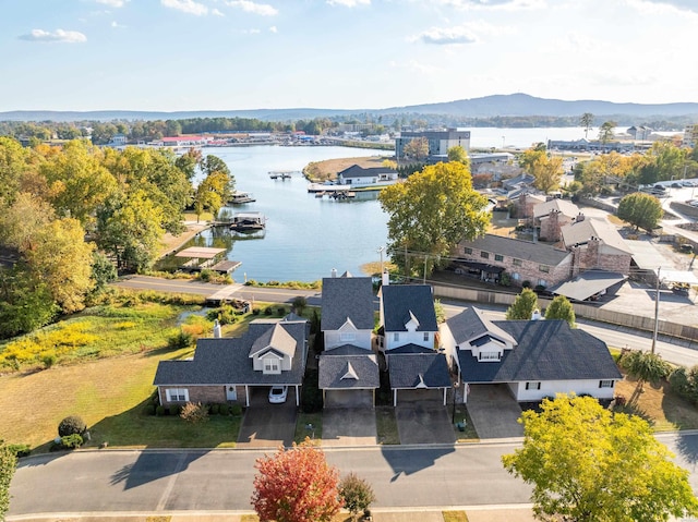 bird's eye view featuring a residential view and a water and mountain view