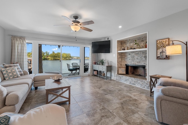 200 Hamilton Oaks Dr Unit N-1, Hot Springs, AR 71913 - living area featuring plenty of natural light, a ceiling fan, a fireplace with raised hearth, and recessed lighting