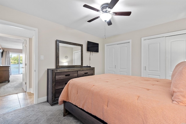 200 Hamilton Oaks Dr Unit N-1, Hot Springs, AR 71913 - carpeted bedroom with two closets, baseboards, and a ceiling fan