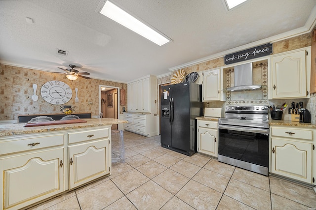 601 Rock Creek Rd, Hot Springs, AR 71913 - kitchen with stainless steel electric stove, black fridge, wall chimney exhaust hood, cream cabinets, and wallpapered walls
