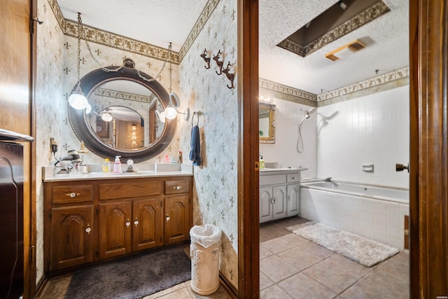 601 Rock Creek Rd, Hot Springs, AR 71913 - bathroom featuring wallpapered walls, a textured ceiling, vanity, tile patterned floors, and tiled shower / bath combo