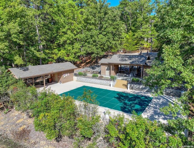 8 Redbird Ln Unit D, Mount Ida, AR 71957 - view of swimming pool featuring a covered pool