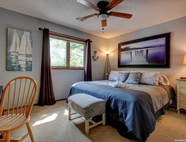 8 Redbird Ln Unit D, Mount Ida, AR 71957 - bedroom featuring carpet, a textured ceiling, baseboards, and ceiling fan