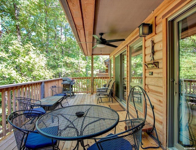 8 Redbird Ln Unit D, Mount Ida, AR 71957 - wooden deck with outdoor dining space, a ceiling fan, and grilling area