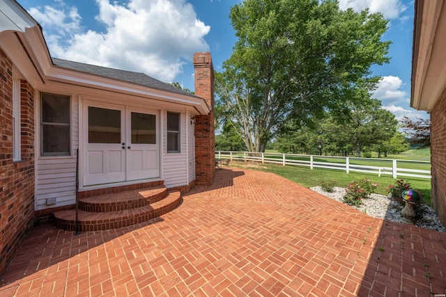 view of patio with entry steps and a fenced backyard