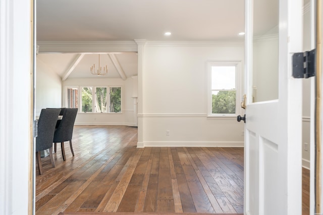 unfurnished room with an inviting chandelier, baseboards, and dark wood-type flooring