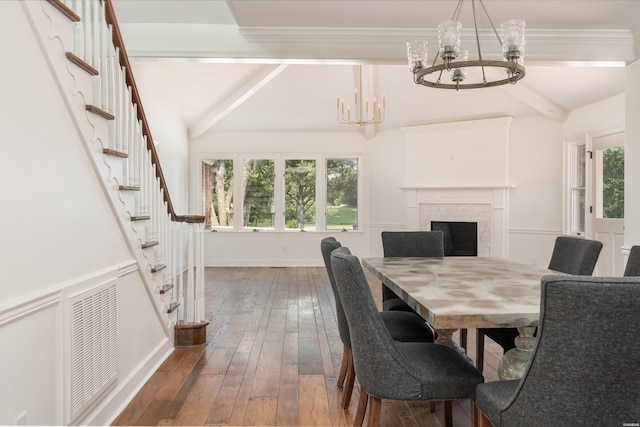 dining space with hardwood / wood-style floors, visible vents, a chandelier, beamed ceiling, and baseboards