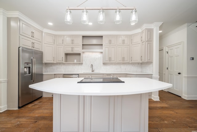 kitchen with dark wood-style floors, stainless steel appliances, open shelves, and a sink