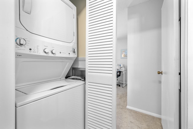 1135 Twin Points Rd Unit D, Hot Springs, AR 71913 - clothes washing area with baseboards, stacked washing maching and dryer, laundry area, and light colored carpet