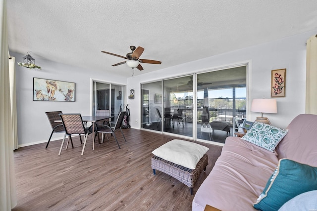 1135 Twin Points Rd Unit D, Hot Springs, AR 71913 - living room featuring ceiling fan, baseboards, wood finished floors, and a textured ceiling
