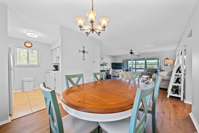 1135 Twin Points Rd Unit D, Hot Springs, AR 71913 - dining space featuring ceiling fan with notable chandelier, wood finished floors, and baseboards