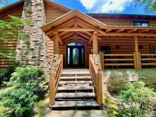 doorway to property featuring a chimney