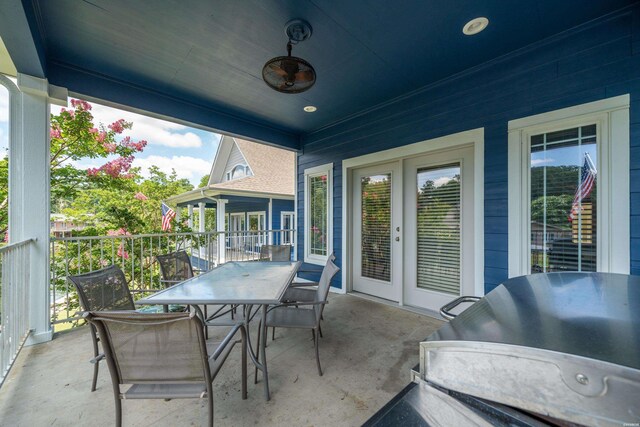 view of patio / terrace with a ceiling fan, outdoor dining space, french doors, and area for grilling