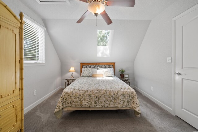 carpeted bedroom featuring lofted ceiling, ceiling fan, and baseboards