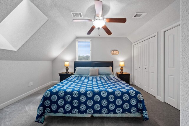 bedroom with lofted ceiling, visible vents, a textured ceiling, and baseboards