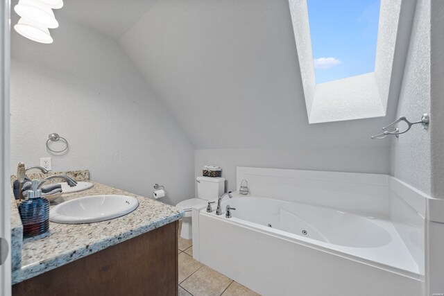 full bath featuring a sink, vaulted ceiling, tile patterned floors, a whirlpool tub, and double vanity